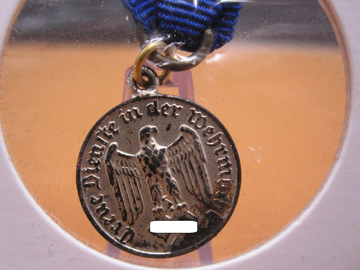 H.W.  -  - Miniatur Medaille für 4 Dienstjahre in der Wehrmacht