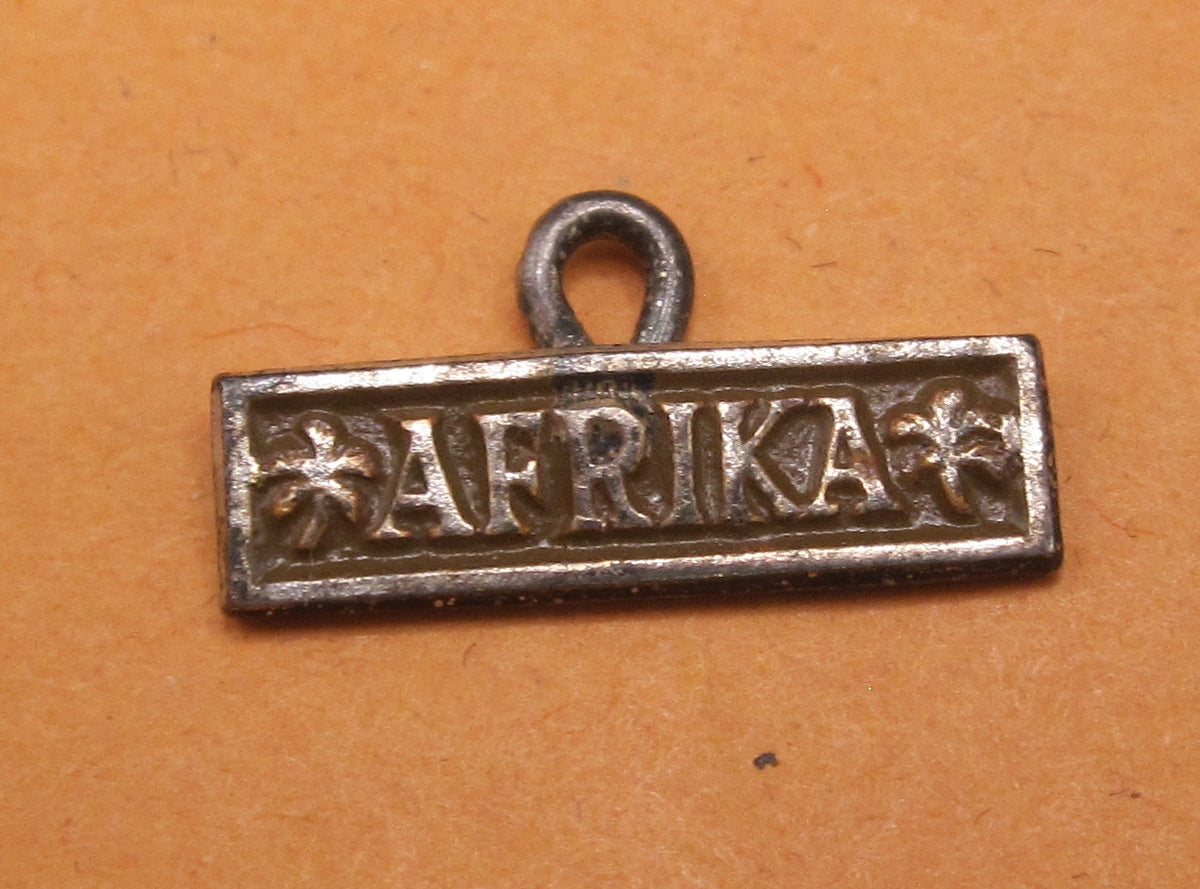 H.W.  -  - Miniatur Ärmelband Afrika Modell / Ausführung 1957