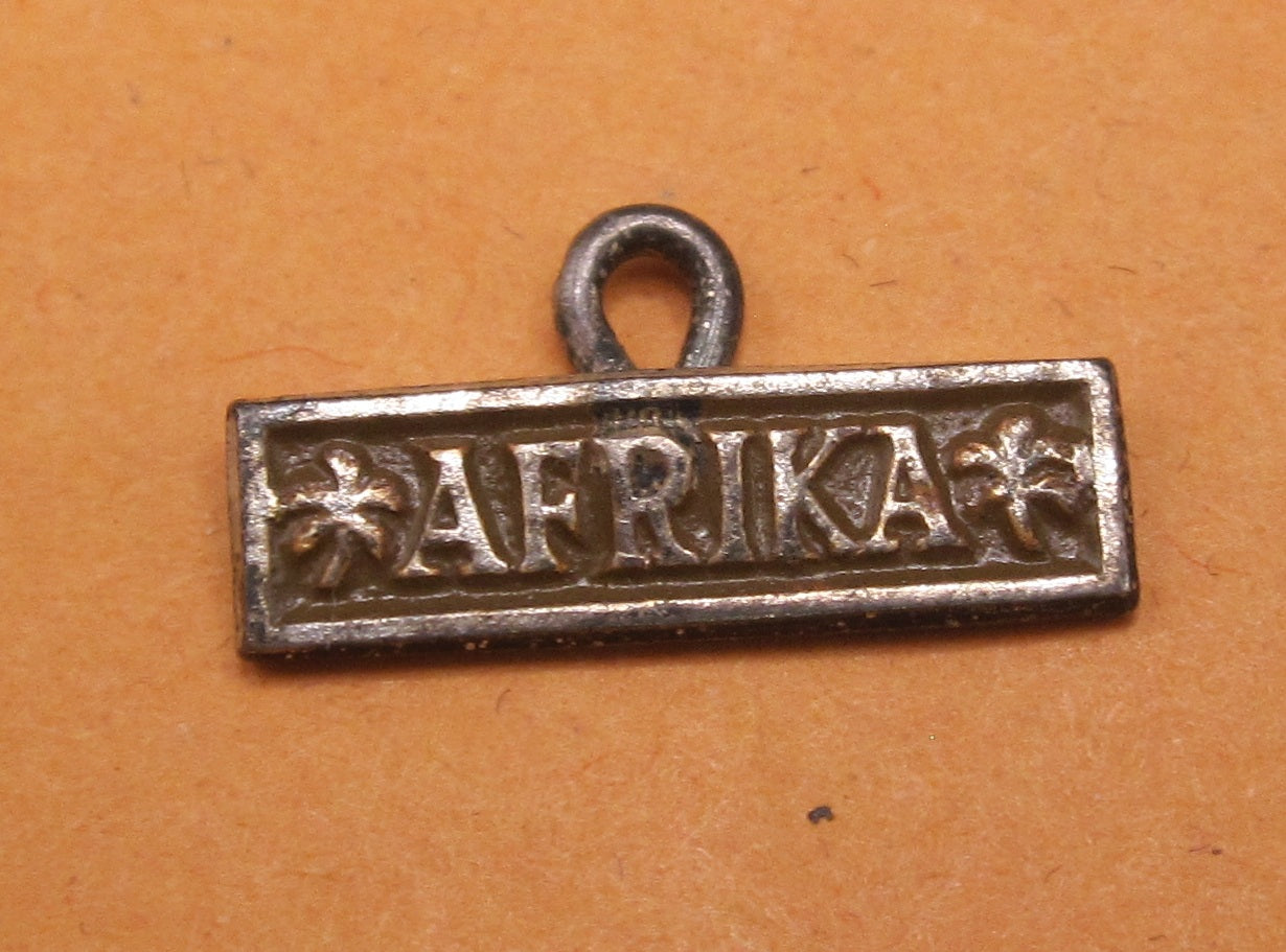 H.W.  -  - Miniatur Ärmelband Afrika Modell / Ausführung 1957