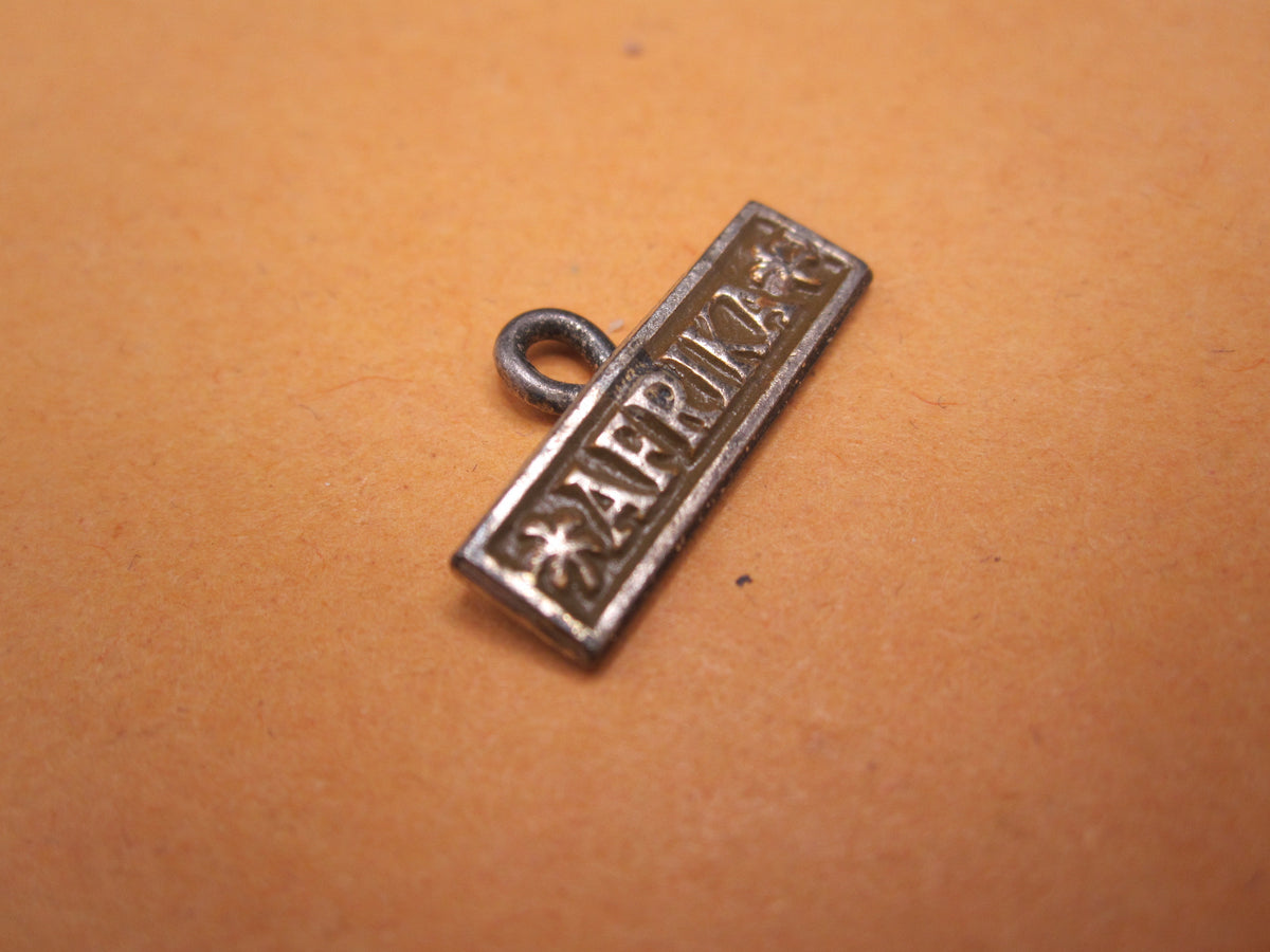 H.W.  -  - Miniatur Ärmelband Afrika Modell / Ausführung 1957