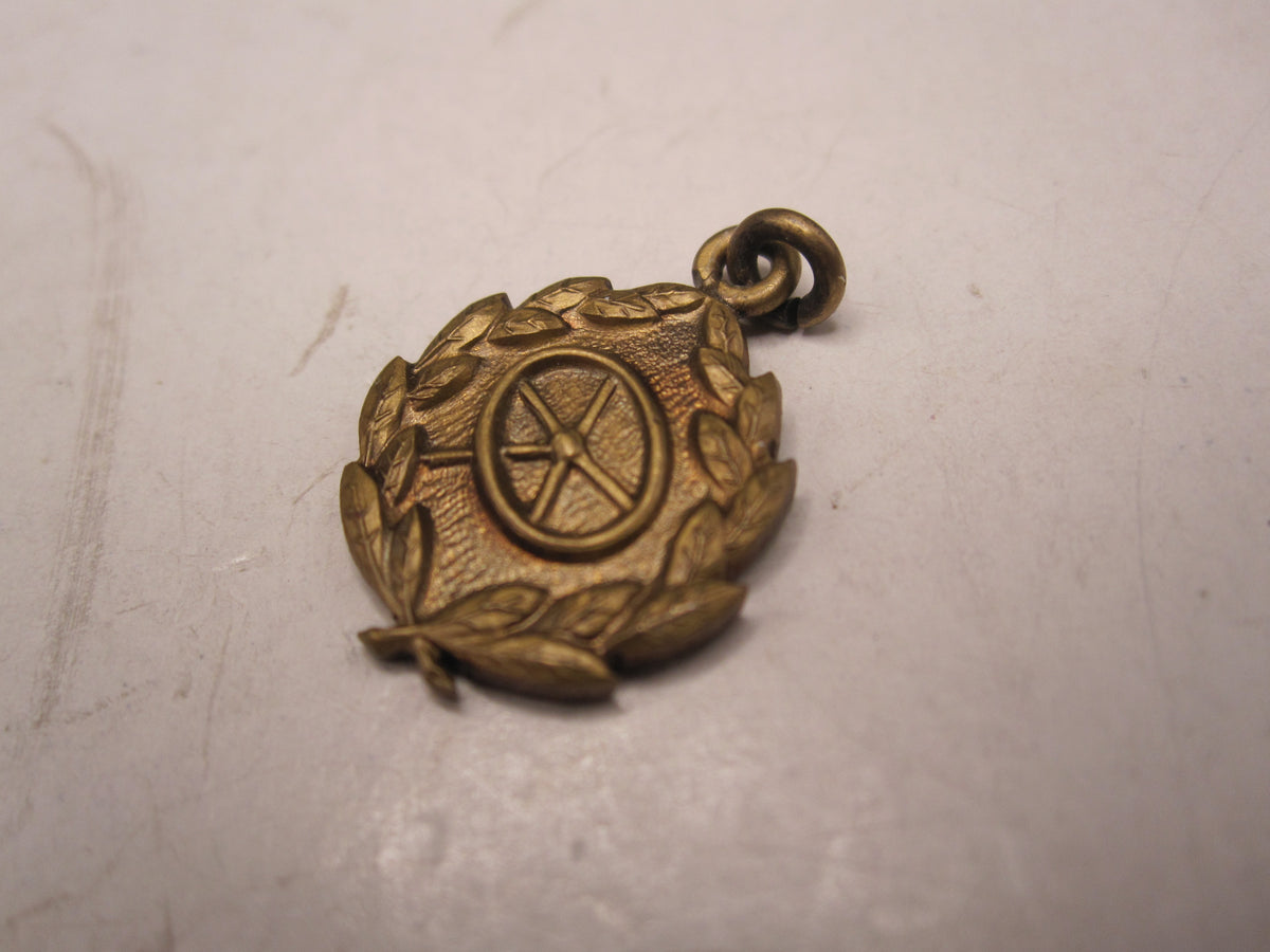 H.W.  -  - Miniatur Kraftfahrbewährungsabzeichen der Wehrmacht in Bronze Modell / Ausführung 1957