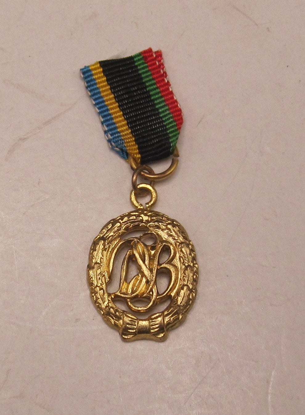 H.W.  -  - Miniatur DSB Sportabzeichen in Gold für die Bundeswehr