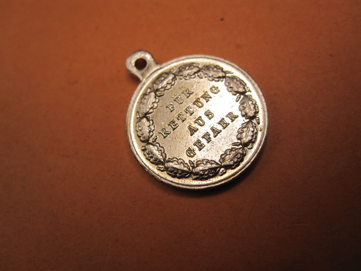 H.W.  -  - Miniatur Medaille für Rettung aus Gefahr Modell / Ausführung 1957