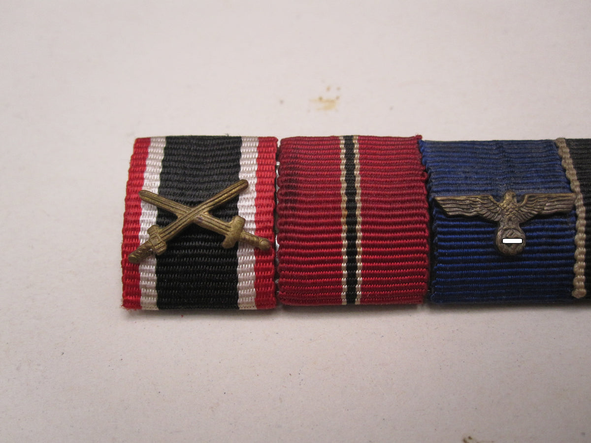 5er Feldspange Kriegsverdienstkreuz 2.Klasse mit Schwertern, Ostmedaille; Dienstauszeichnung der Wehrmacht; Spange Prager Burg , Schutzwallmedaille