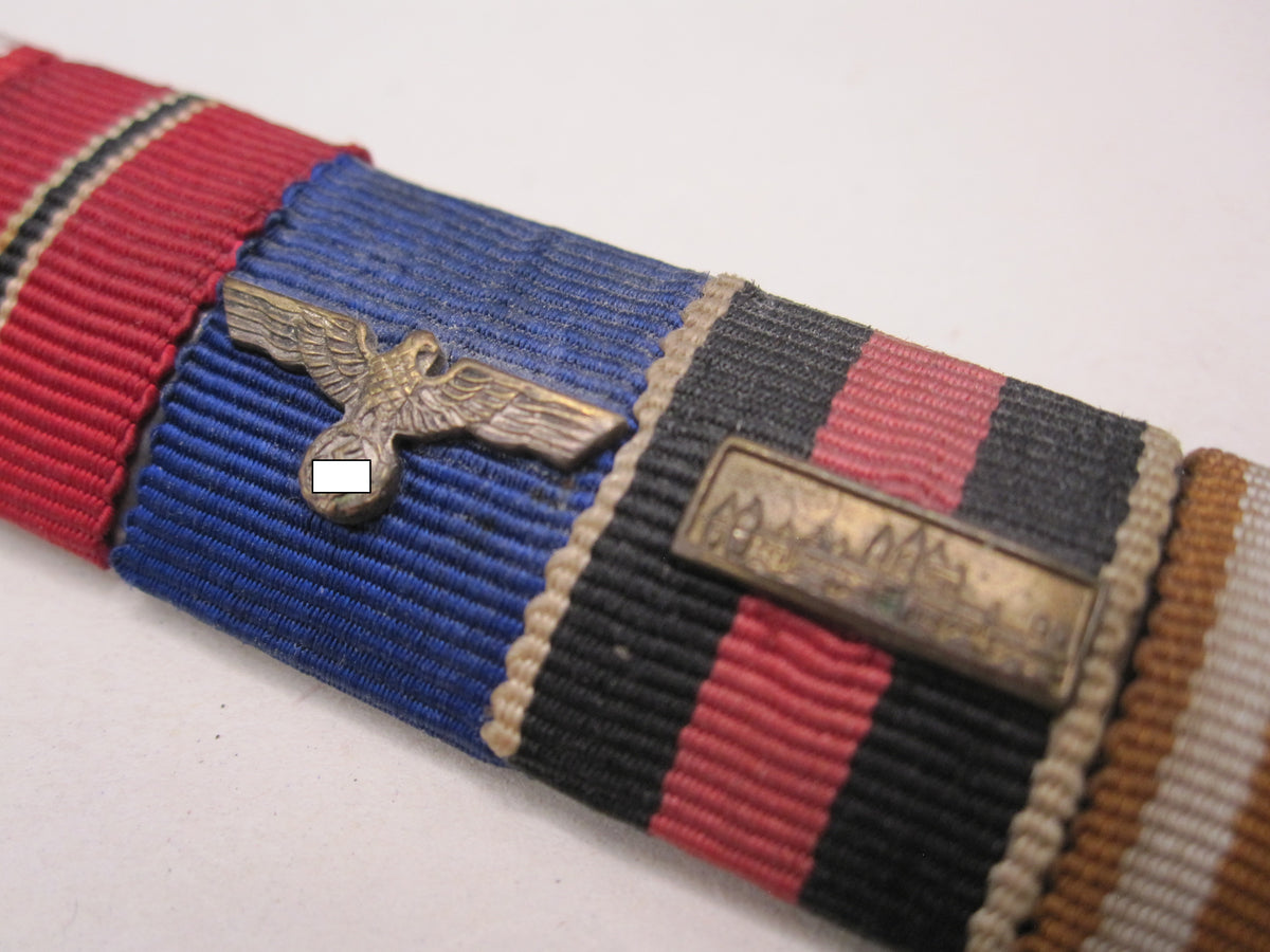 5er Feldspange Kriegsverdienstkreuz 2.Klasse mit Schwertern, Ostmedaille; Dienstauszeichnung der Wehrmacht; Spange Prager Burg , Schutzwallmedaille