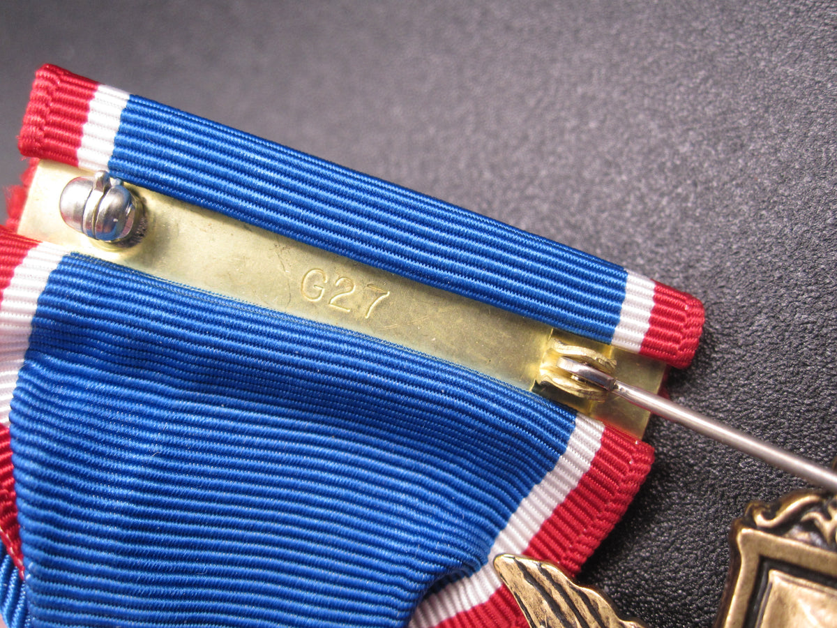 H.W.  - -   Distinguished Service Cross