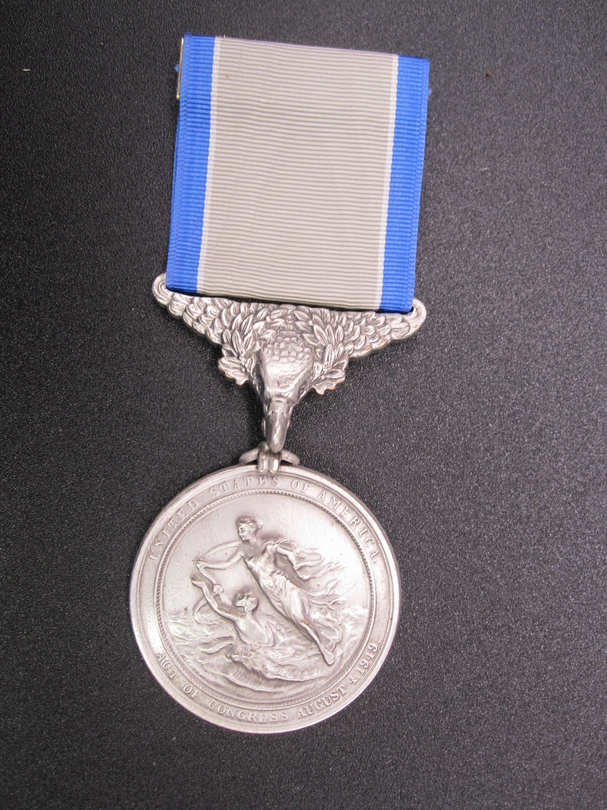 H.W.  - -   Lifesaving Medal in Silver