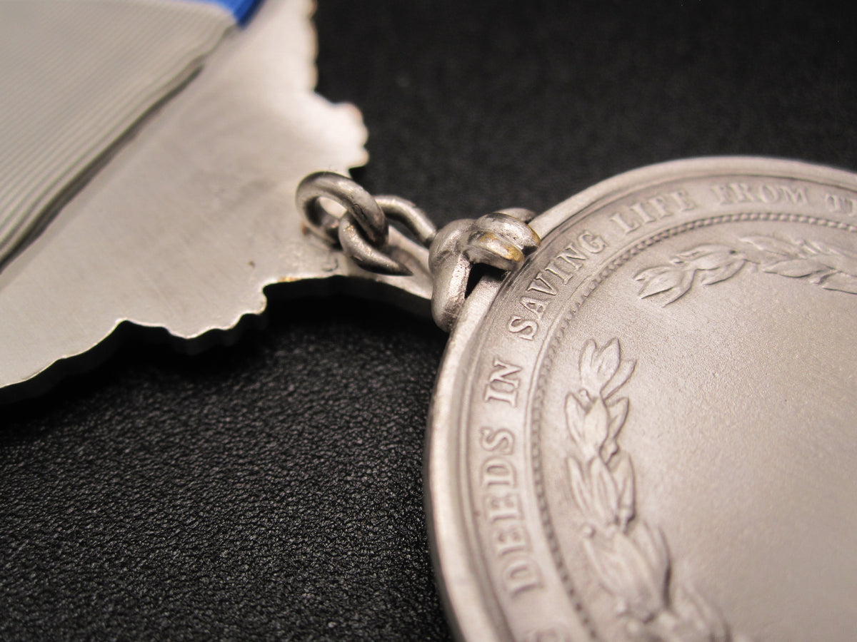 H.W.  - -   Lifesaving Medal in Silver