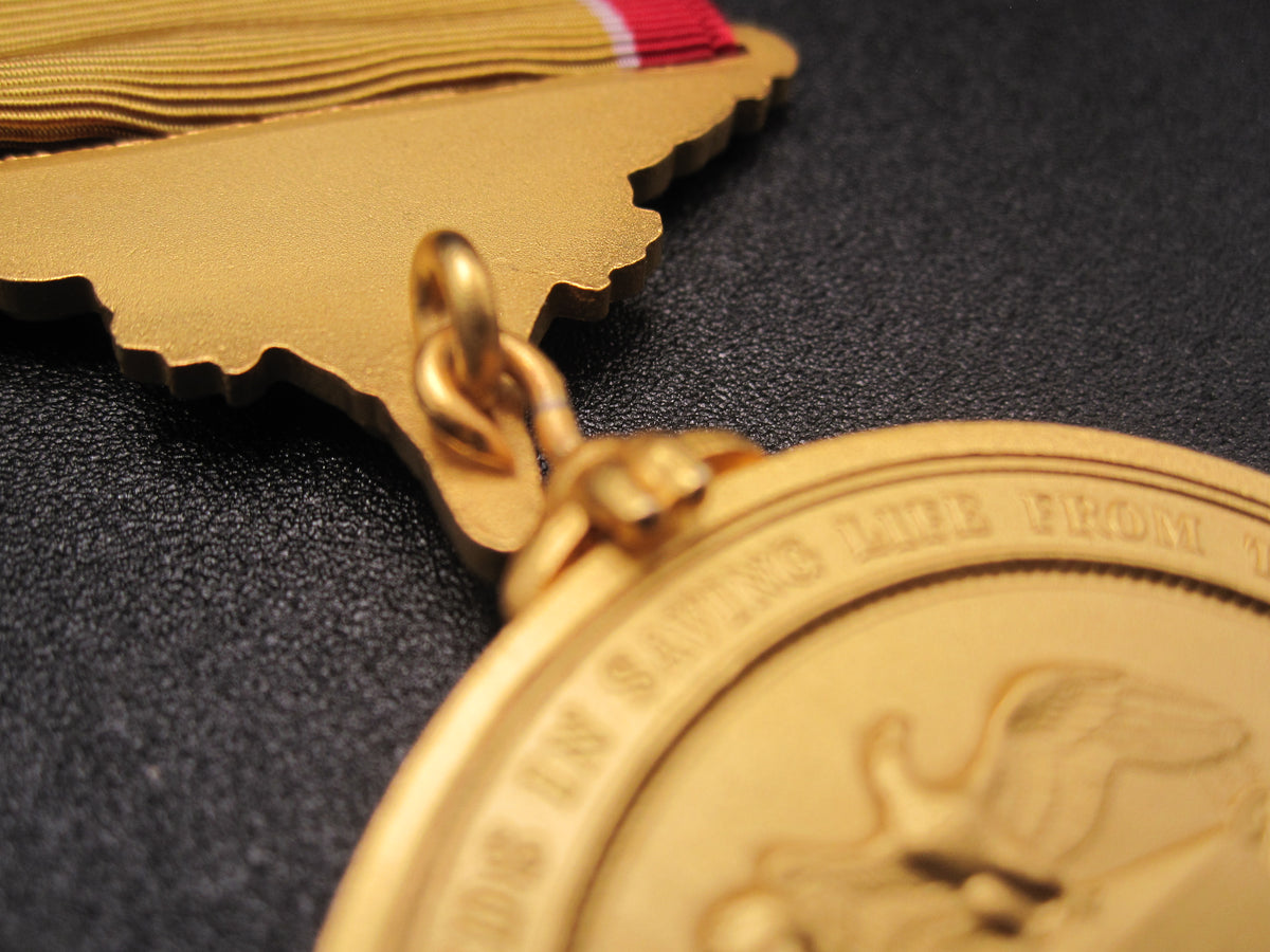 H.W.  - -   Lifesaving Medal in Gilt / Gold