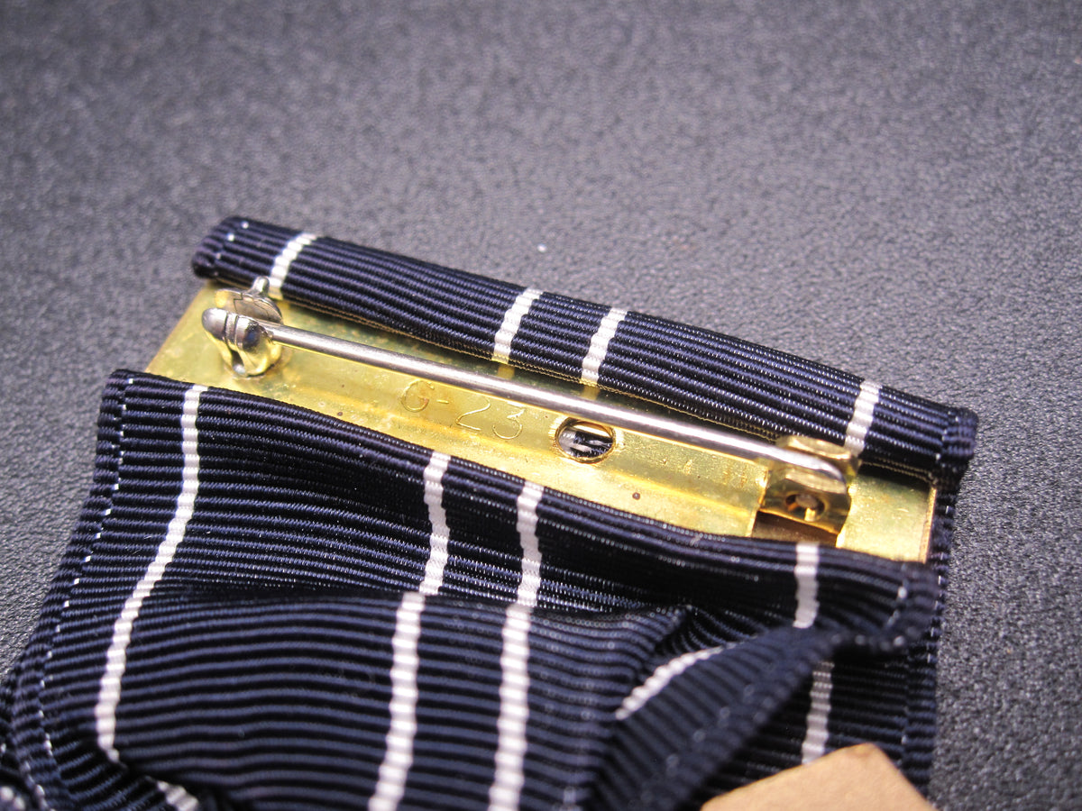 H.W.  - -   Expert Riflemen Medal