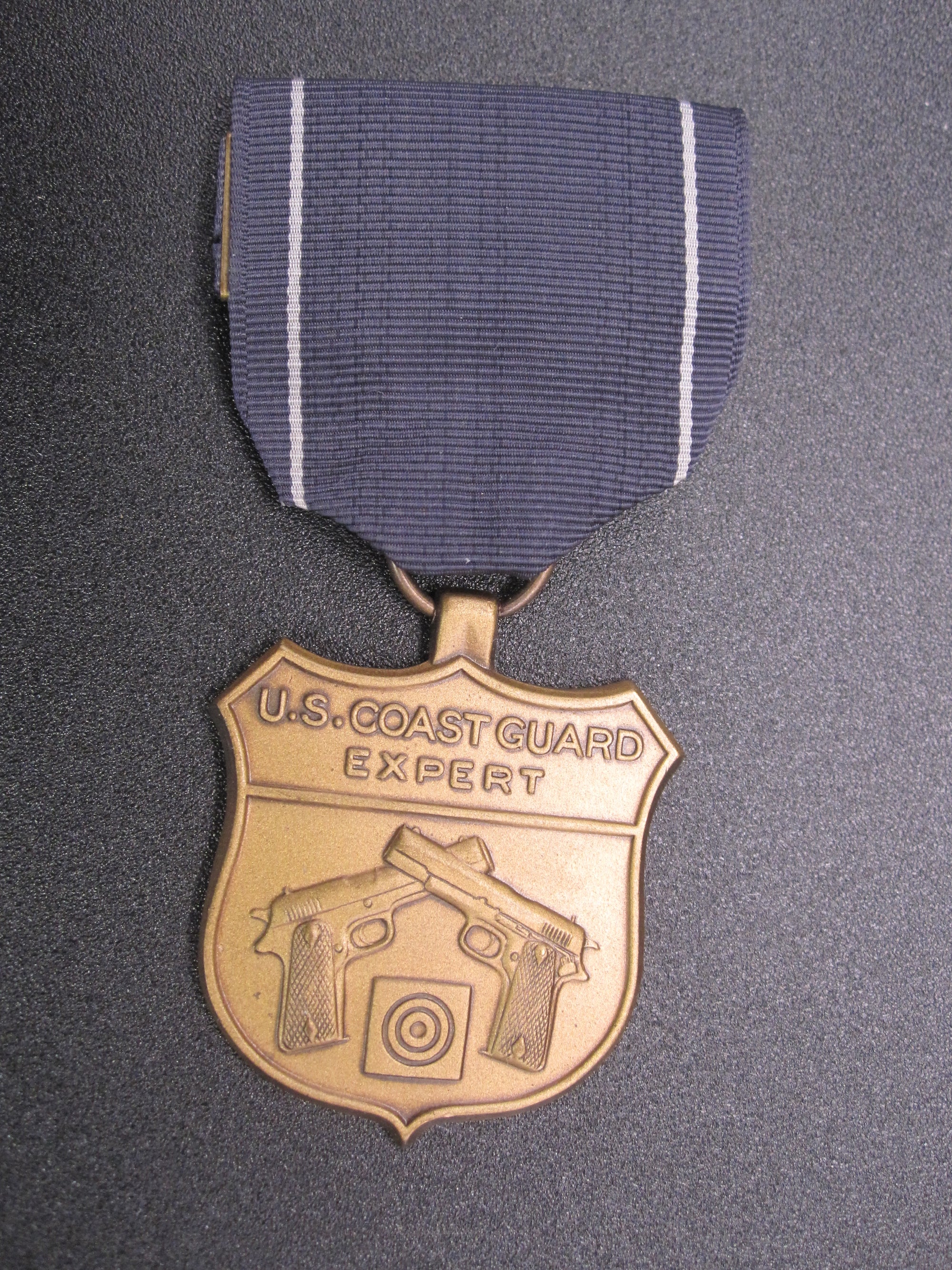 H.W.  - -   Expert Pistol Medal