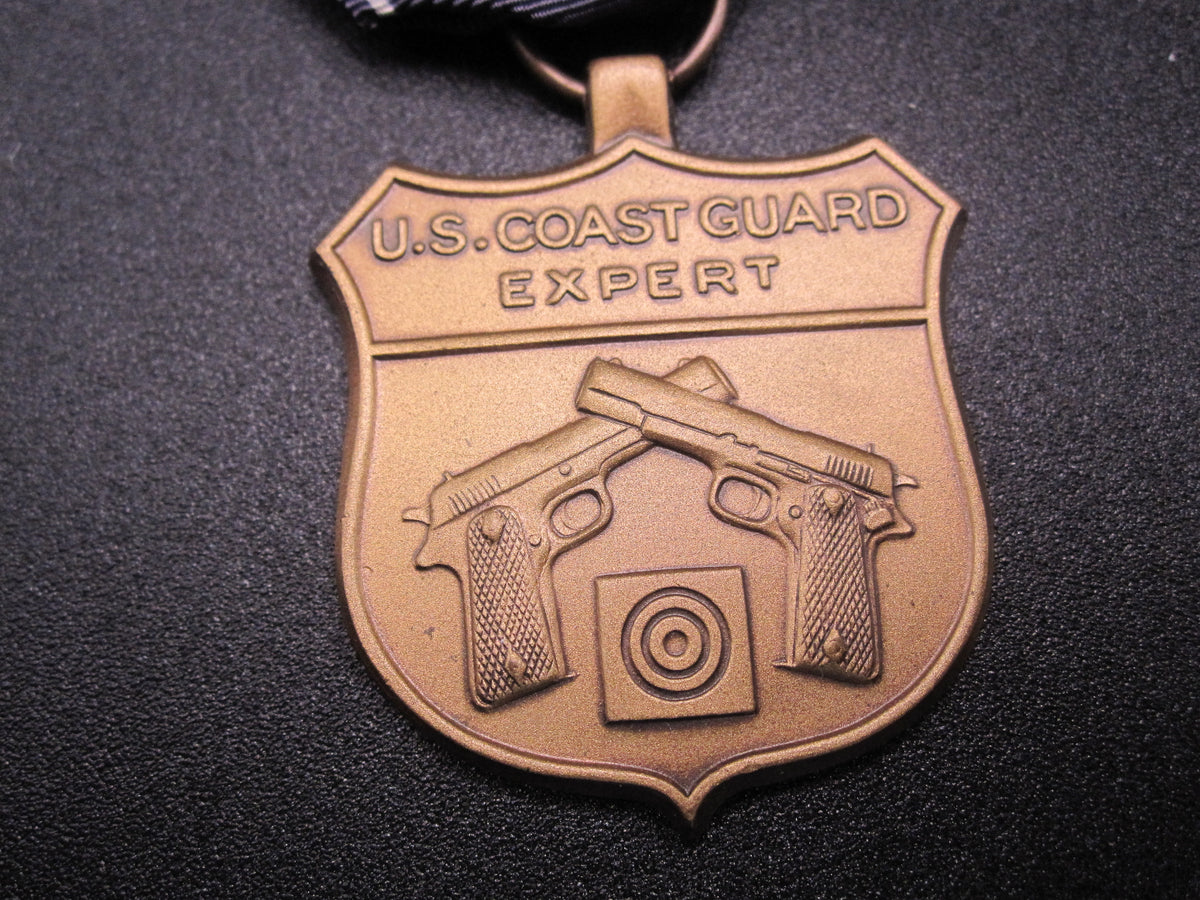 H.W.  - -   Expert Pistol Medal
