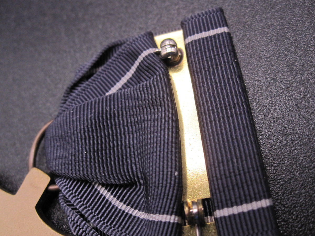 H.W.  - -   Expert Pistol Medal
