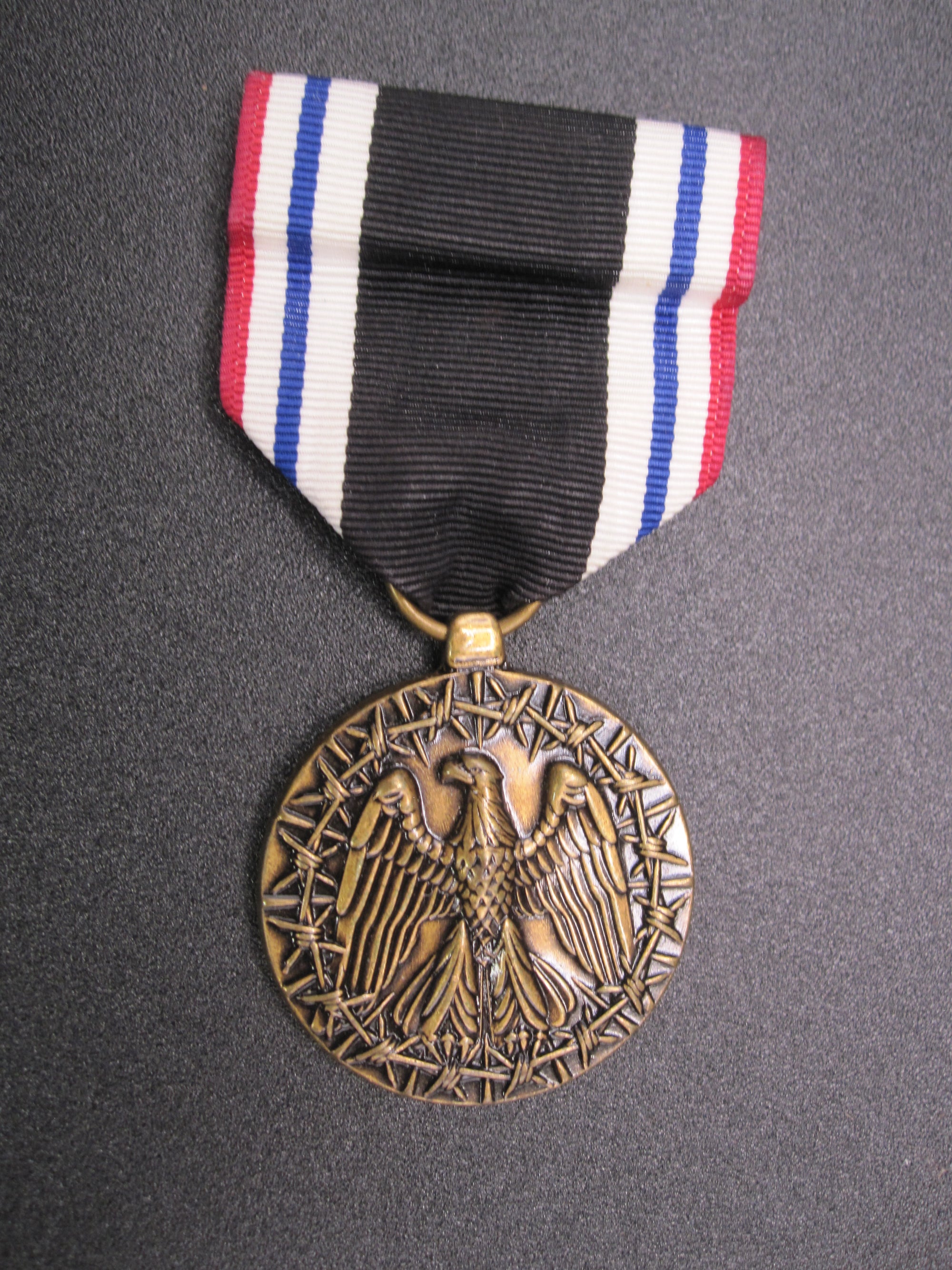 H.W.  - -    Prisoner of War Medal