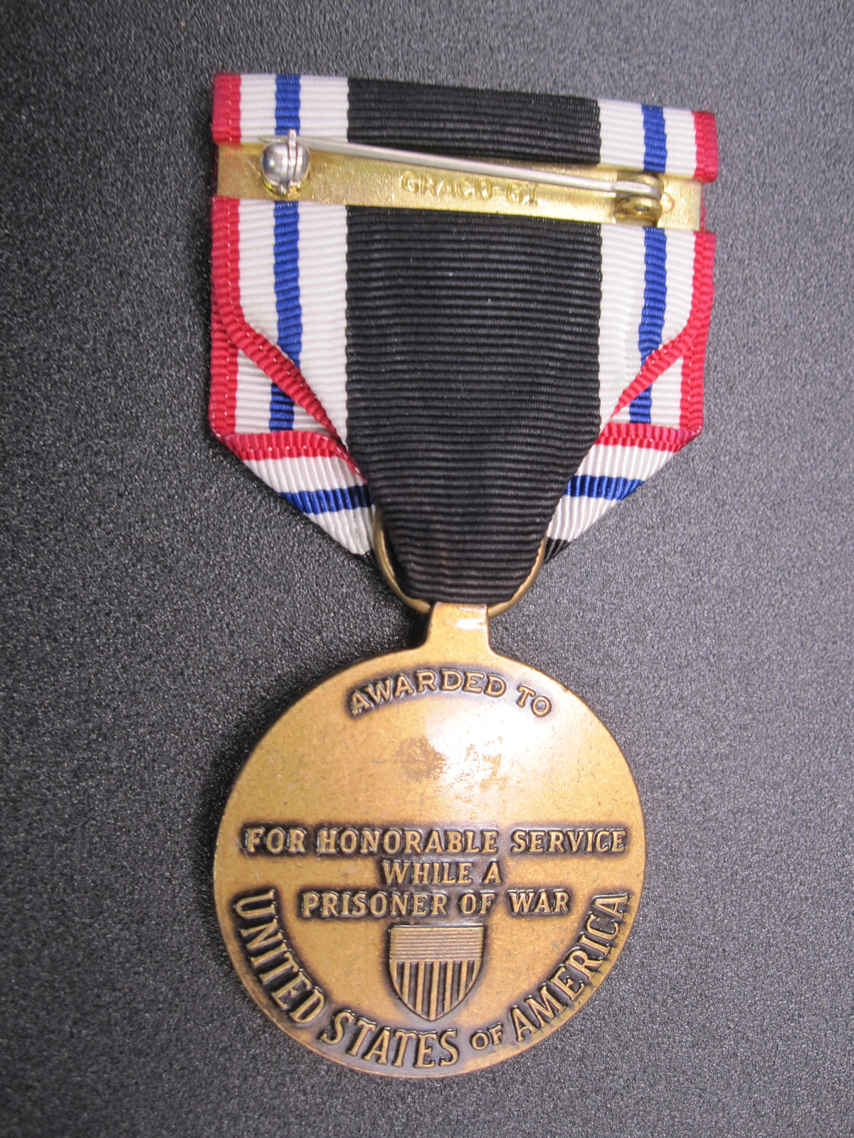 H.W.  - -    Prisoner of War Medal