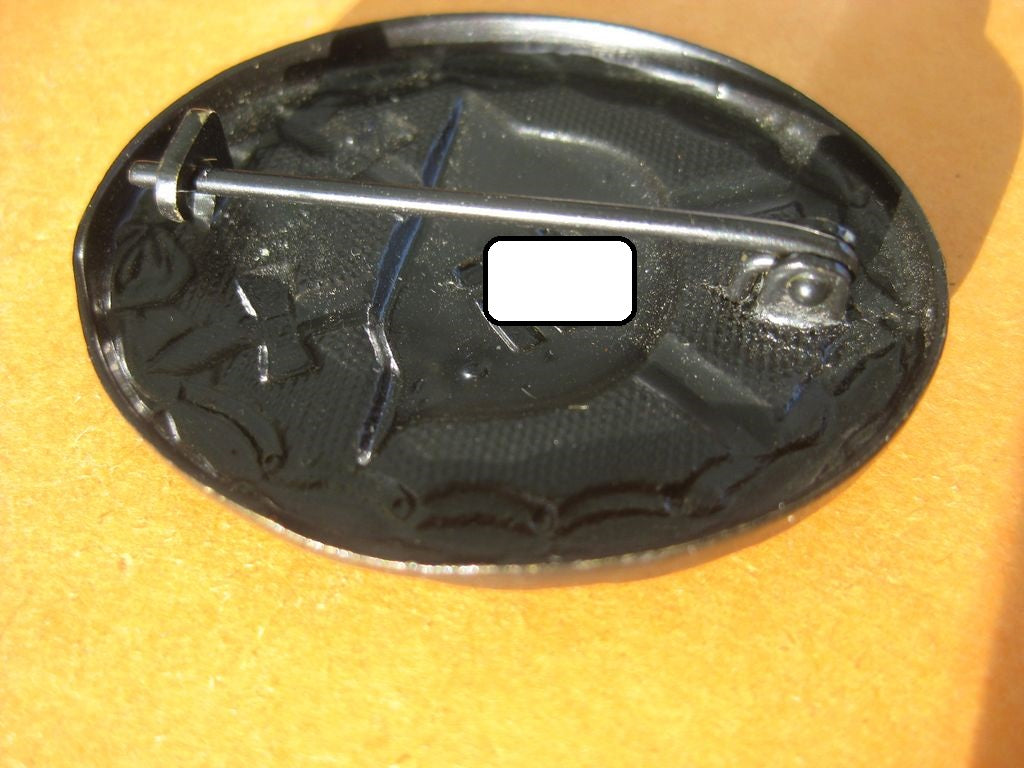 Verwundetenabzeichen in Schwarz in der Verkaufsschachtel/Verpackung /Etui